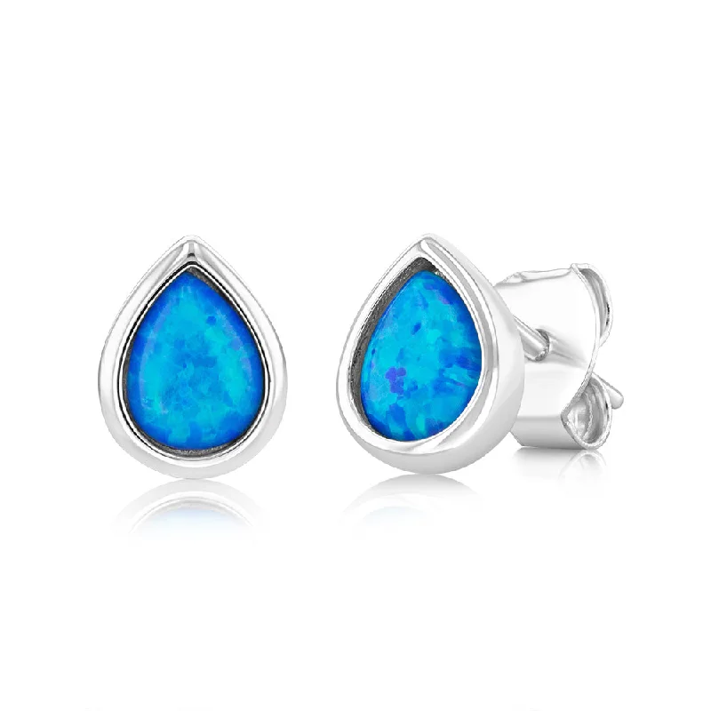 dainty earrings for women -Sterling Silver Pear Shaped Created Blue Topaz Stud Earrings